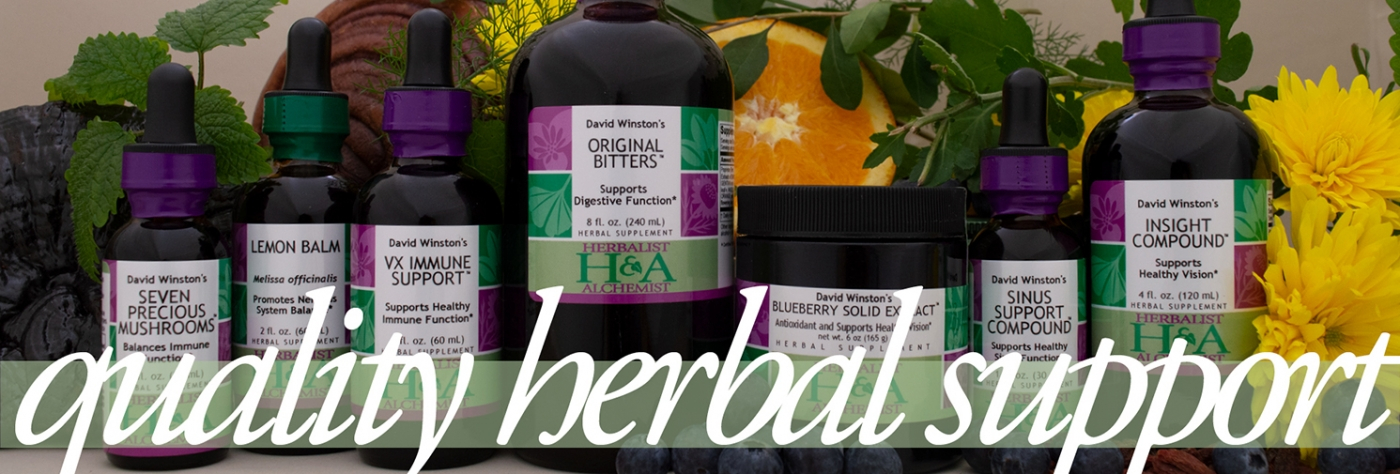 herbalist and alchemist  various bottles herbal products with botanicals infused